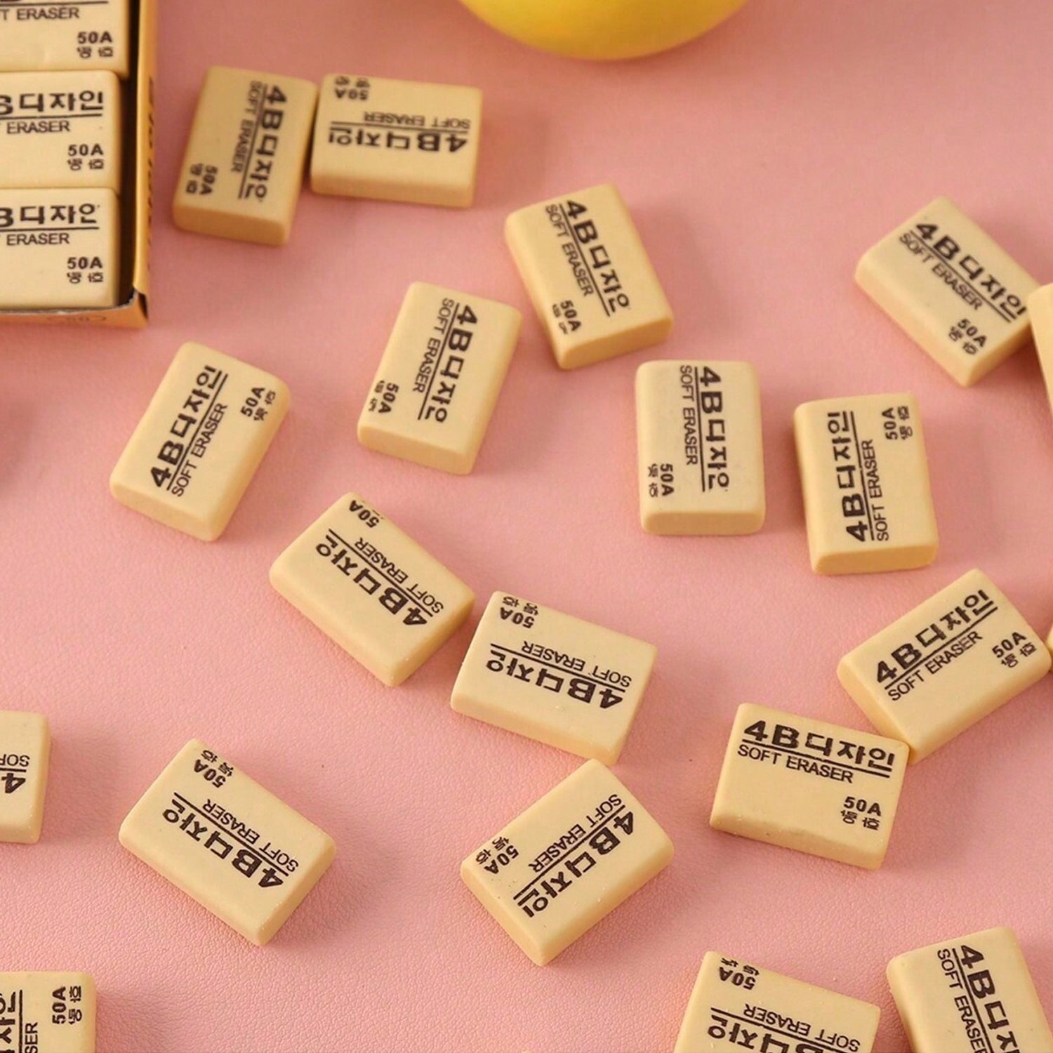 A rectangular bright yellow 4B eraser ready for school or office tasks.