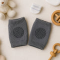 Dark grey wool knit toddler leg warmers providing knee protection
