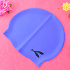 Junior wave silicone swimming cap designed for comfortable, secure fit during swim sessions