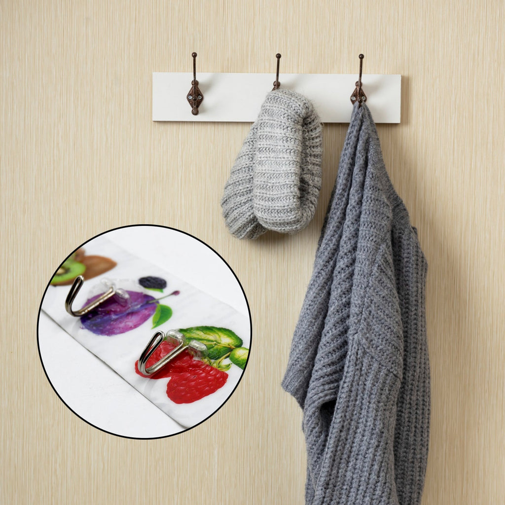 Set of six transparent adhesive wall hooks organized neatly for home and office use.