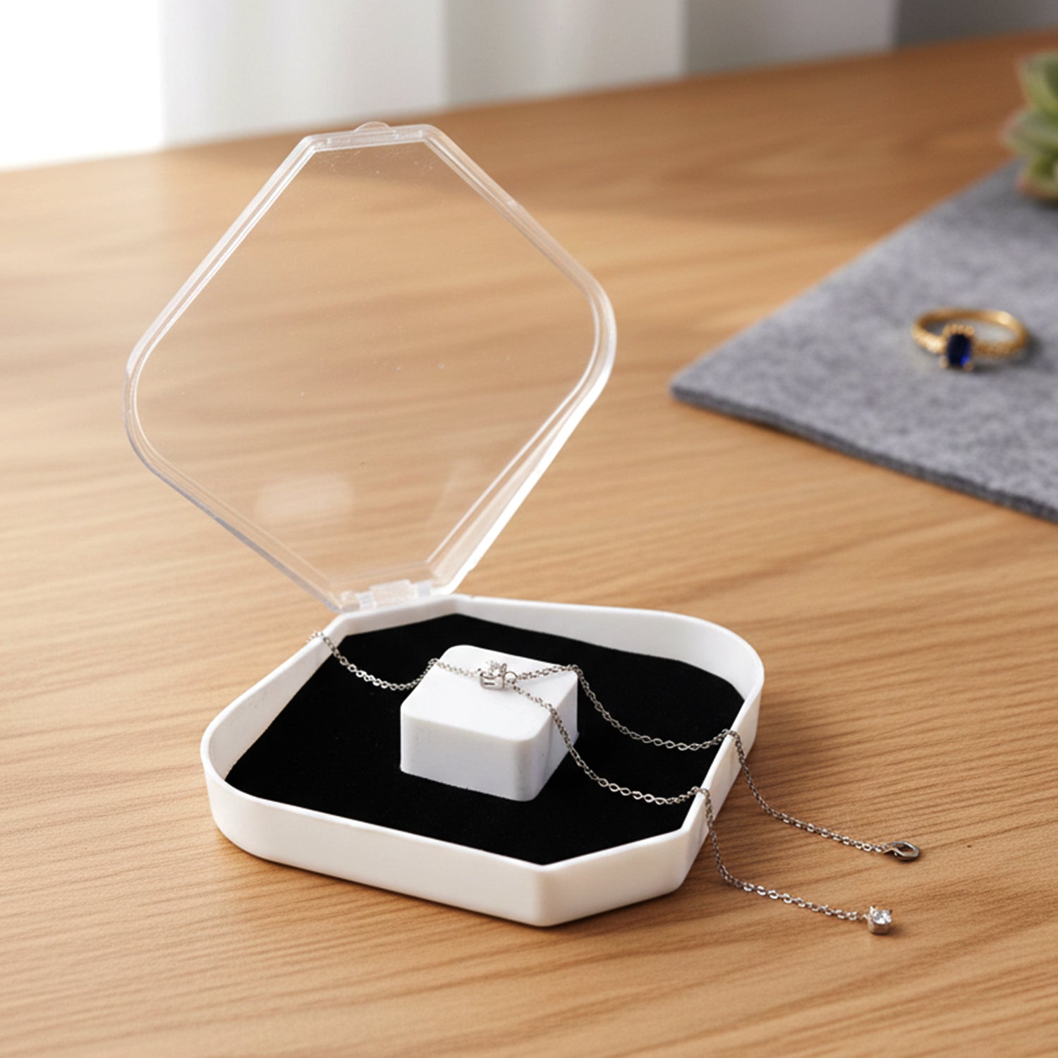 Open mini jewellery box showing soft cushion insert for ring and earring storage