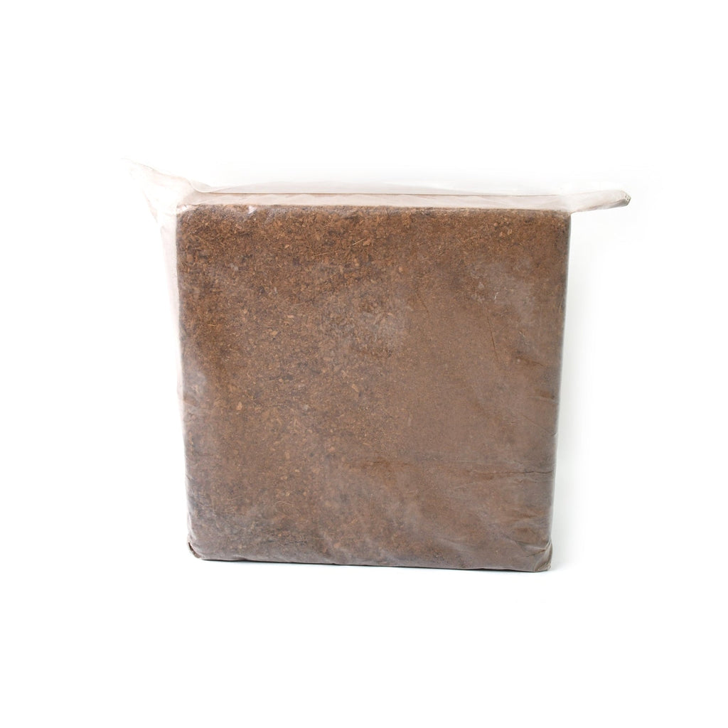 Organic Cocopeat Block expanding after hydration, for lush plant growth.