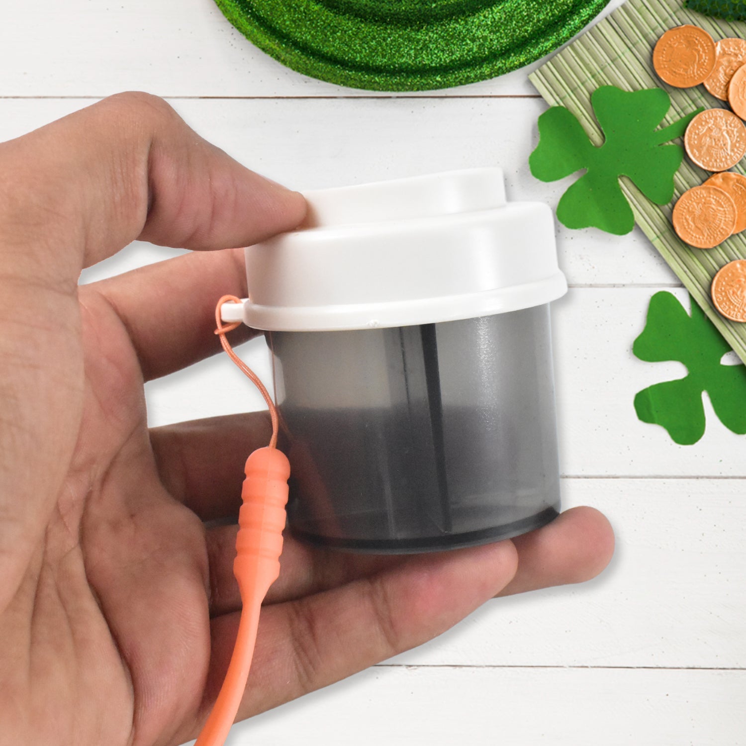 Mixed color plastic pill box with easy pill dispensing