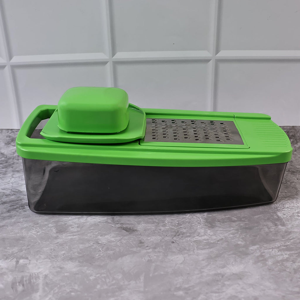 Manual vegetable dicer with multiple blade inserts and compact design