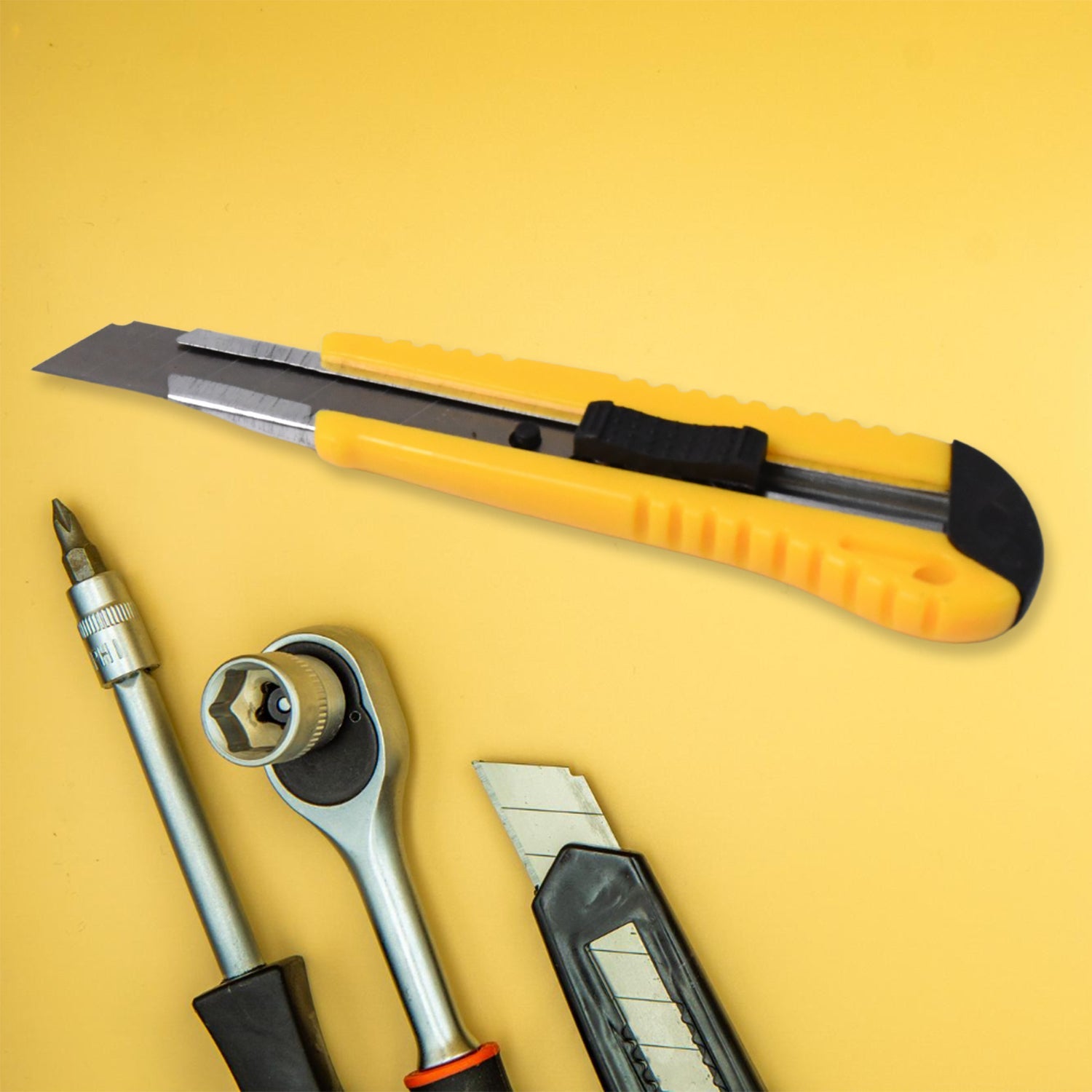 Set of 4 essential hand tools including screwdriver and cutter in protective case