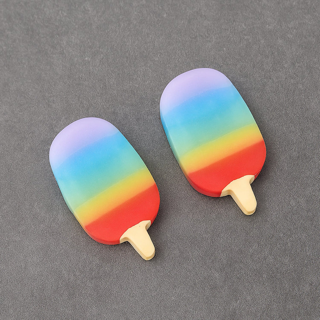 Cute popsicle erasers placed on a notebook, ready for schoolwork.