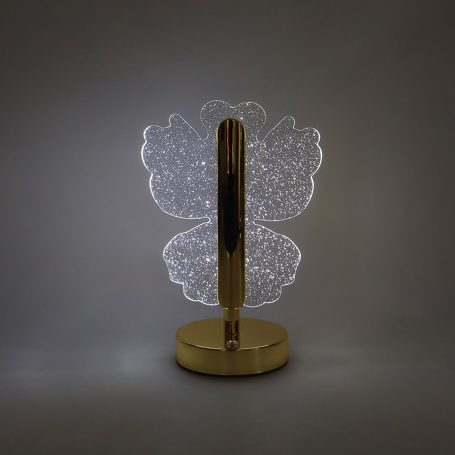 Decorative crystal table lamp emitting warm LED light