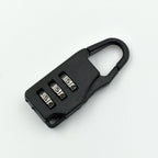 A sleek black 3-digit luggage lock securely attached to a suitcase zipper.