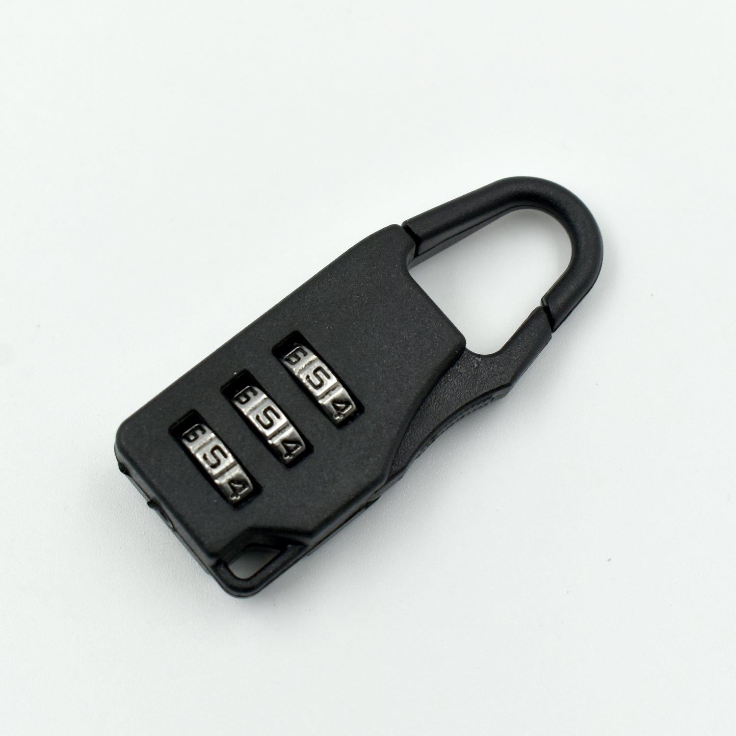 A sleek black 3-digit luggage lock securely attached to a suitcase zipper.