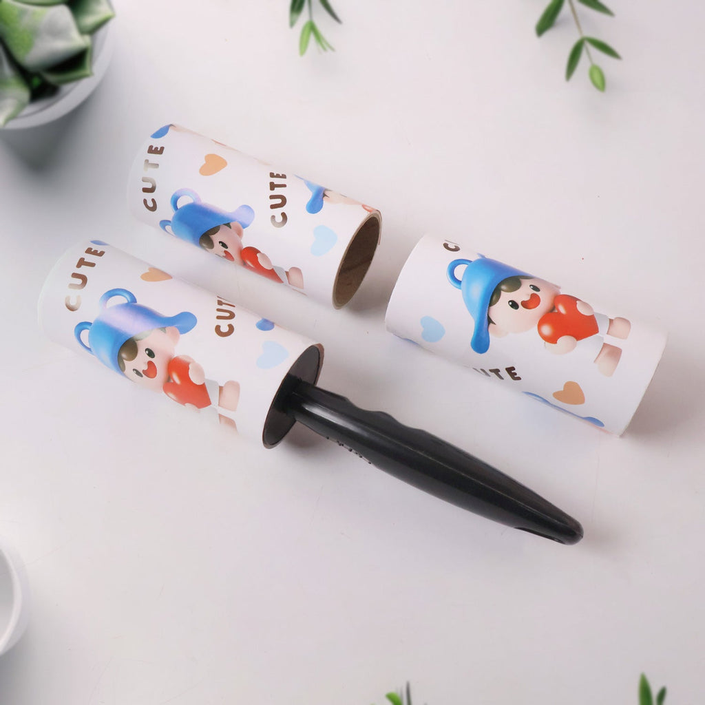 Hand holding lint roller rolling over clothes to remove lint and dust