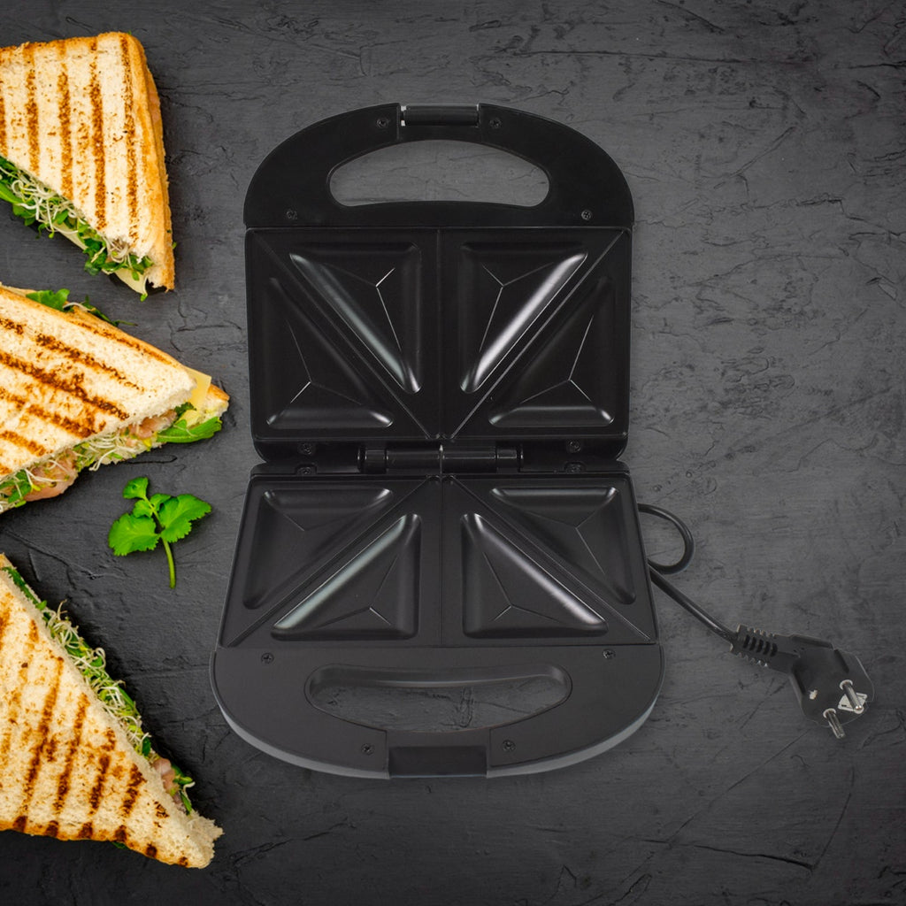 Sandwich toaster showing indicator lights to signal cooking status