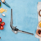 Lightweight aluminum garlic press shown crushing a garlic clove.