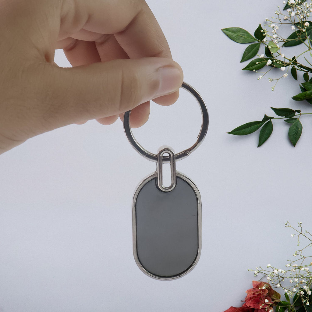 Stylish urban accent oval metal key ring in black and silver