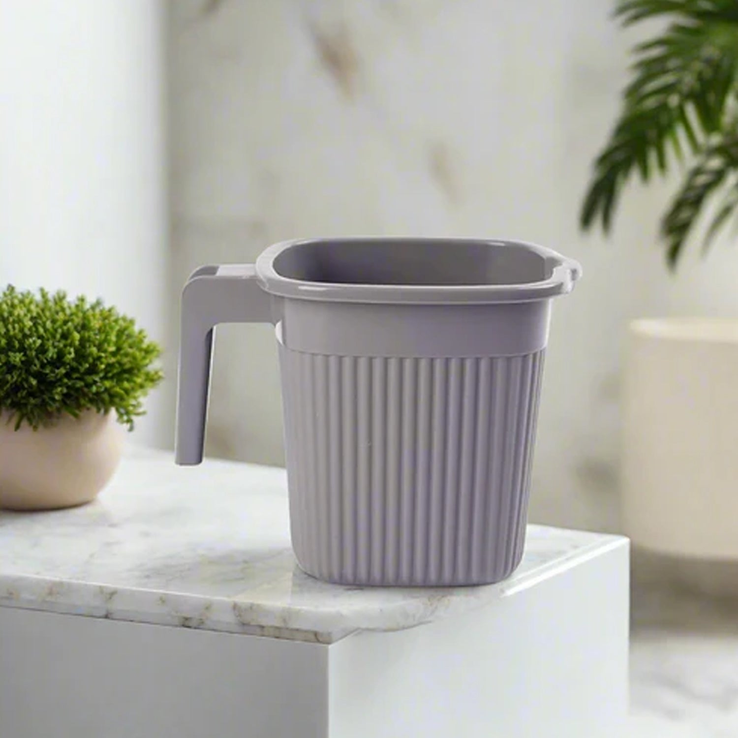 Four versatile square plastic mugs, suitable for various household uses.