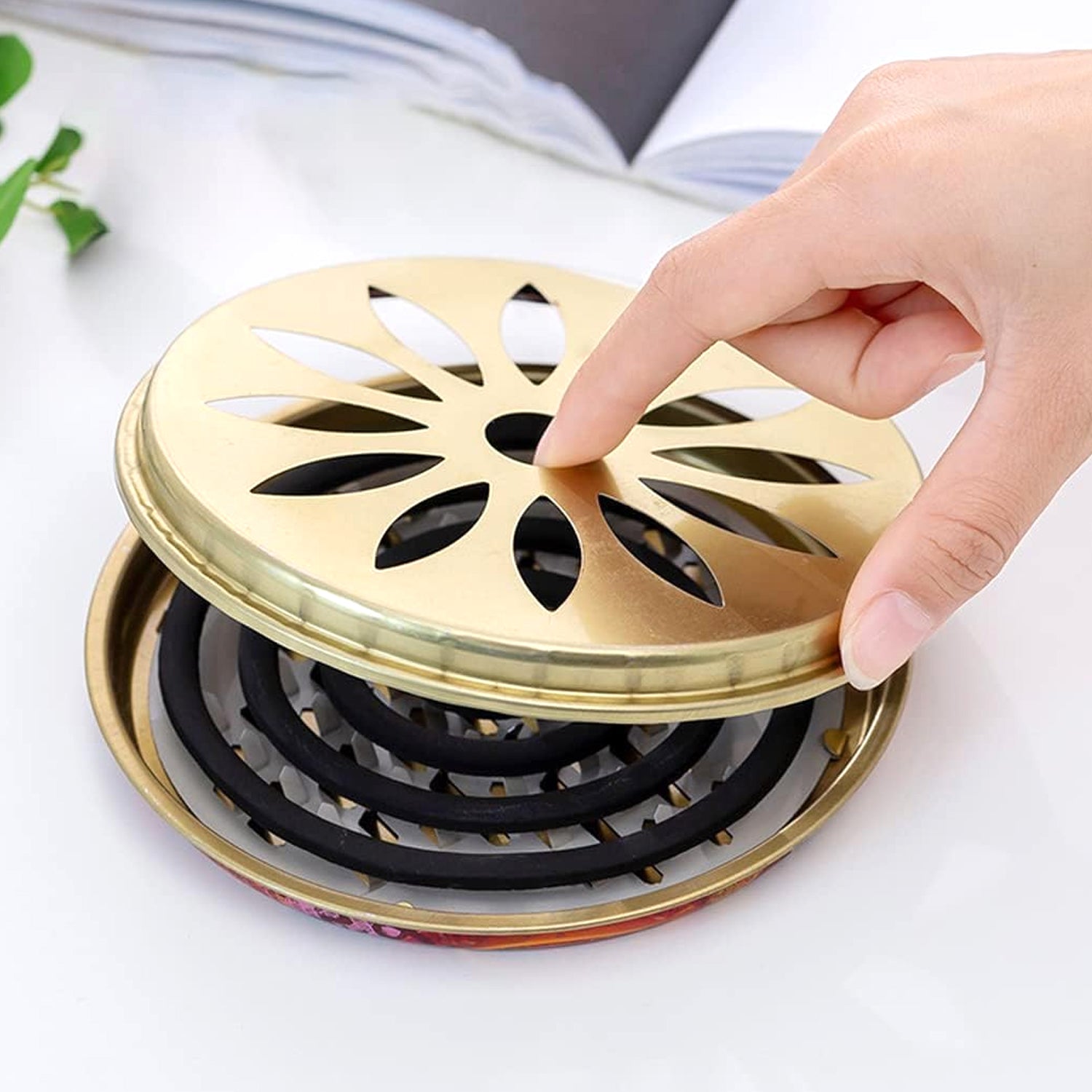 Top view showing ventilated cover of metal mosquito coil and incense burner stand
