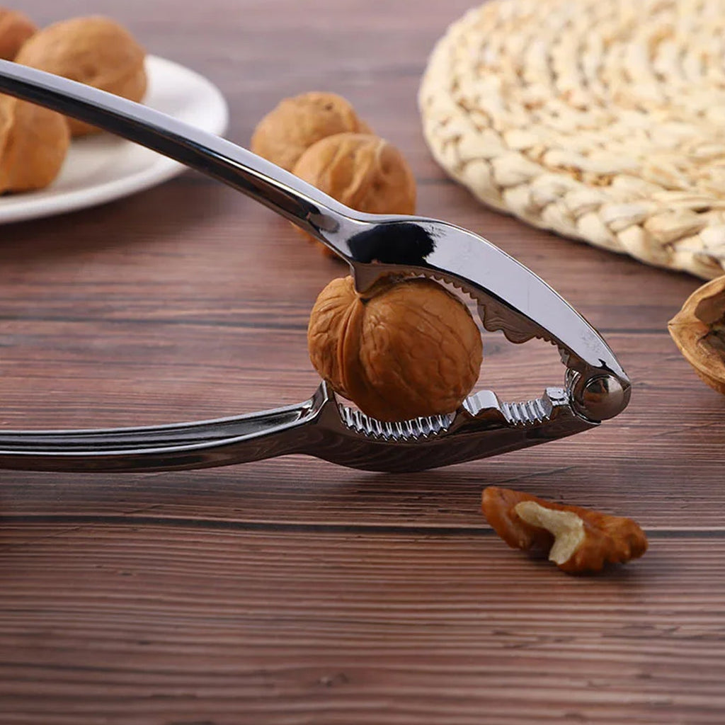 Top-down view of the durable stainless steel walnut cracker.