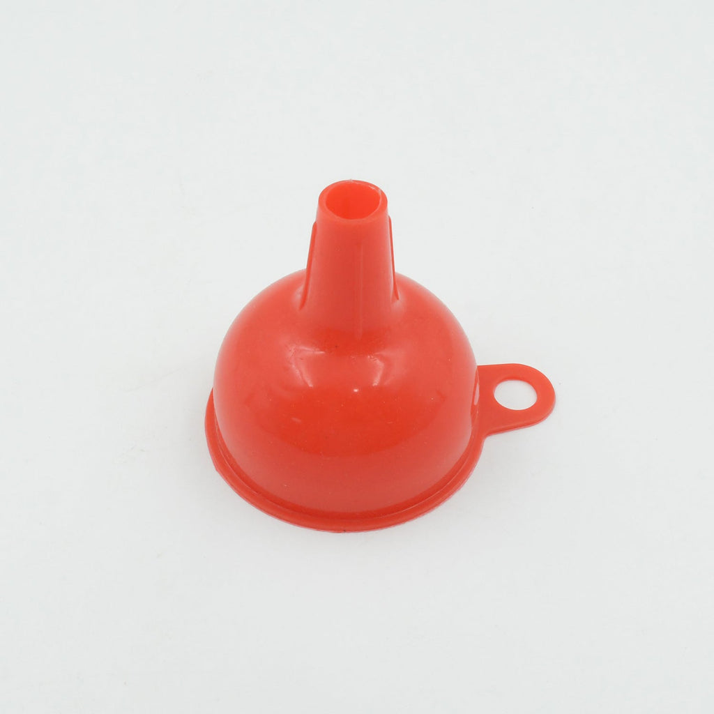 Silicone funnel in action, efficiently pouring oil into a bottle.