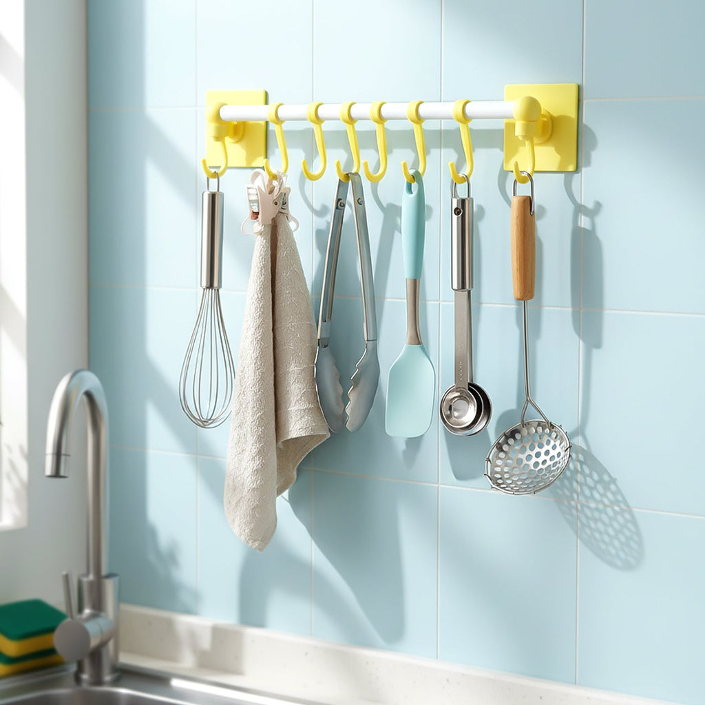 Close-up of utensil hanging rod with removable J shaped hooks in kitchen