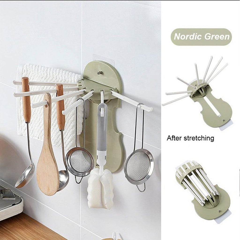 The versatile retractable wall hanger neatly organizing kitchen utensils.