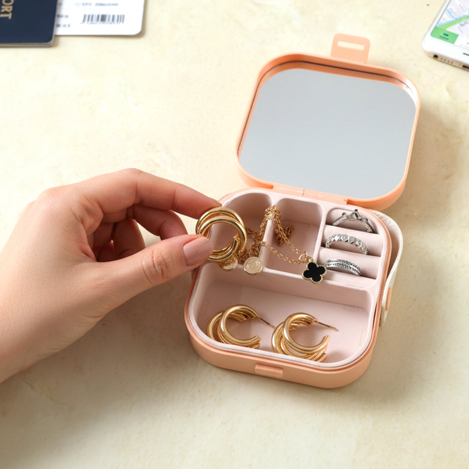 Side view of portable mini jewelry box with built-in mirror