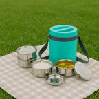 Nekza insulated tiffin box with 4 stainless steel compartments, shown open.