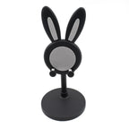 The Bunny Phone Stand in a home office setting, perfect for desk organization.