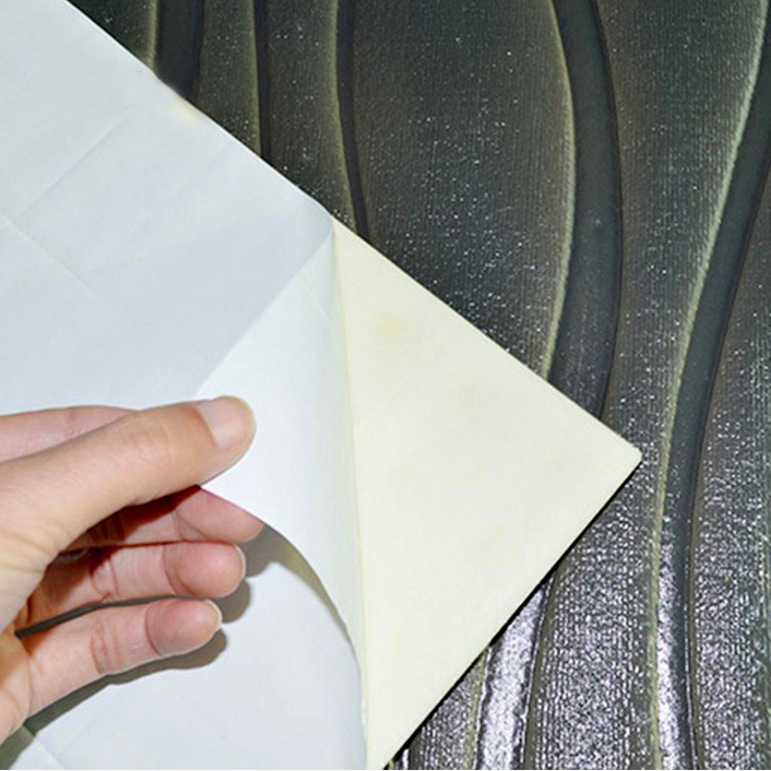 Arrangement of multiple 3D square foam tiles on a wall.