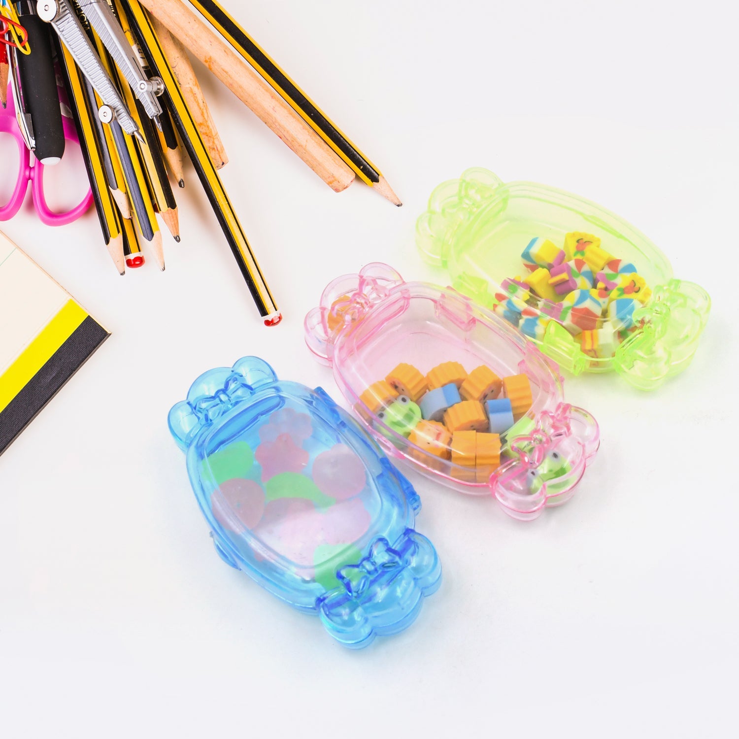 Neatly arranged collection of colorful rubber erasers in a compact set.