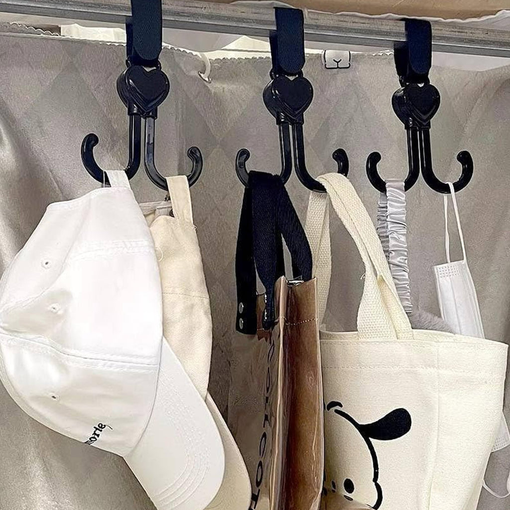 A 360-degree rotating stroller hook securely attached to a baby stroller handle.