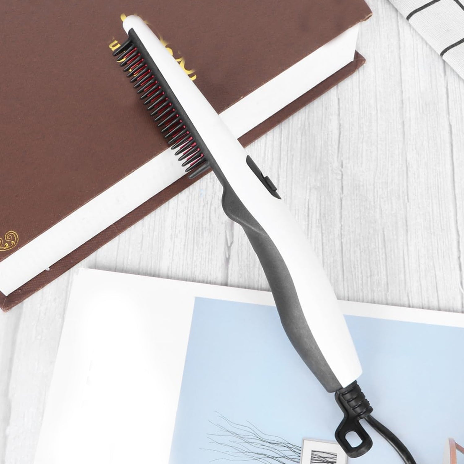 Side view of the electric hair straightening comb showing temperature controls.