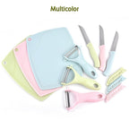 Green handled vegetable peeler displayed alongside the two sleek stainless steel knives.