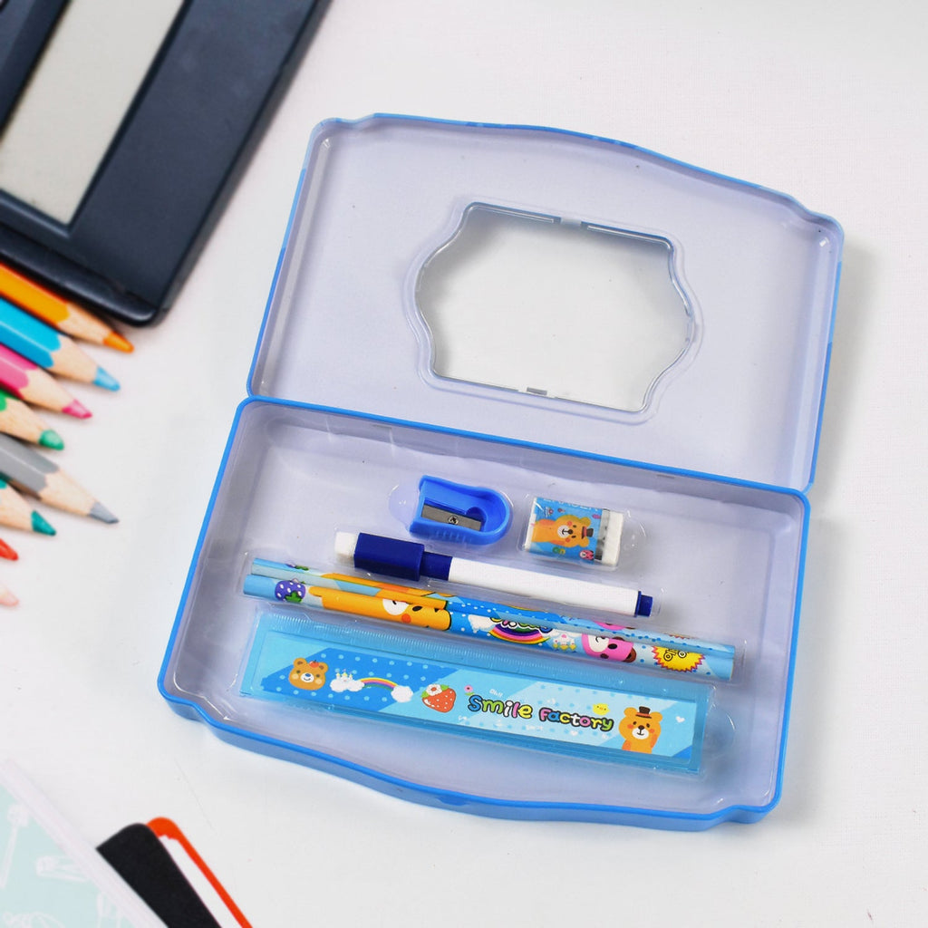 Detailed shot of the essential stationery items like pencil, sharpener, and scale inside the metal case.