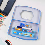 Detailed shot of the essential stationery items like pencil, sharpener, and scale inside the metal case.