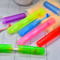 Six clear plastic travel toothbrush covers neatly stacked for hygienic storage.
