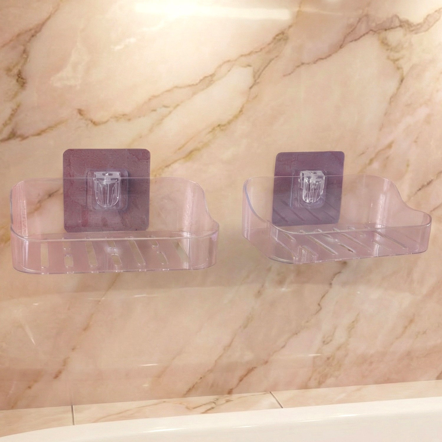 Transparent soap dish with slotted base allowing water drainage to keep soap dry