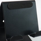 Front view of metal mobile and tablet stand showcasing compact and portable design