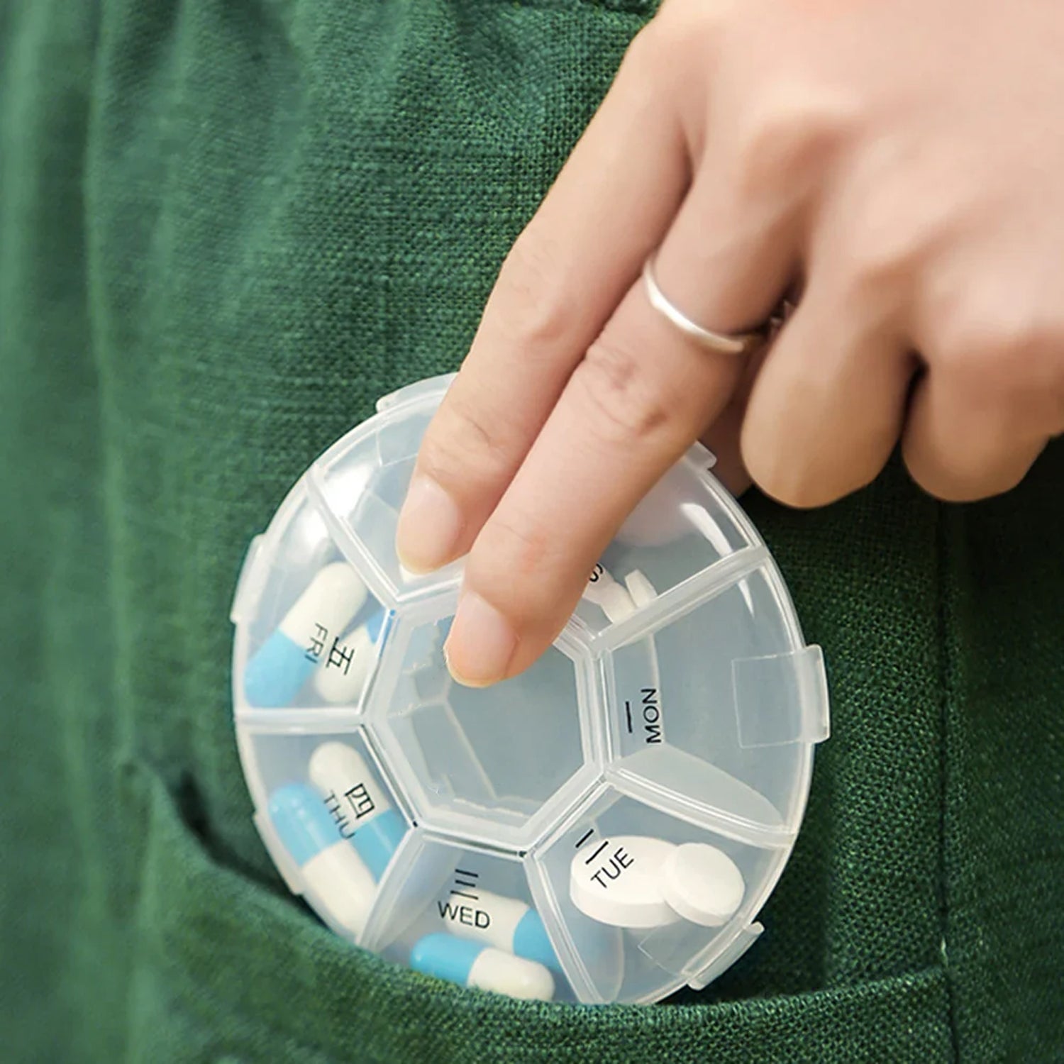 7-sided portable pill box with clear lids showing organized daily compartments