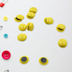 Assorted magnetic particle circles used for teaching and organizing notes.