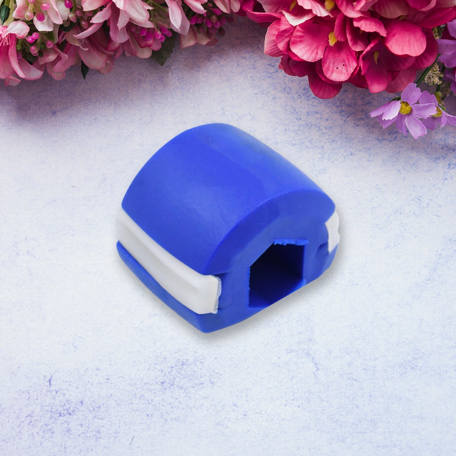 Dark blue Jawline Exerciser shown at an angle, ready for use.