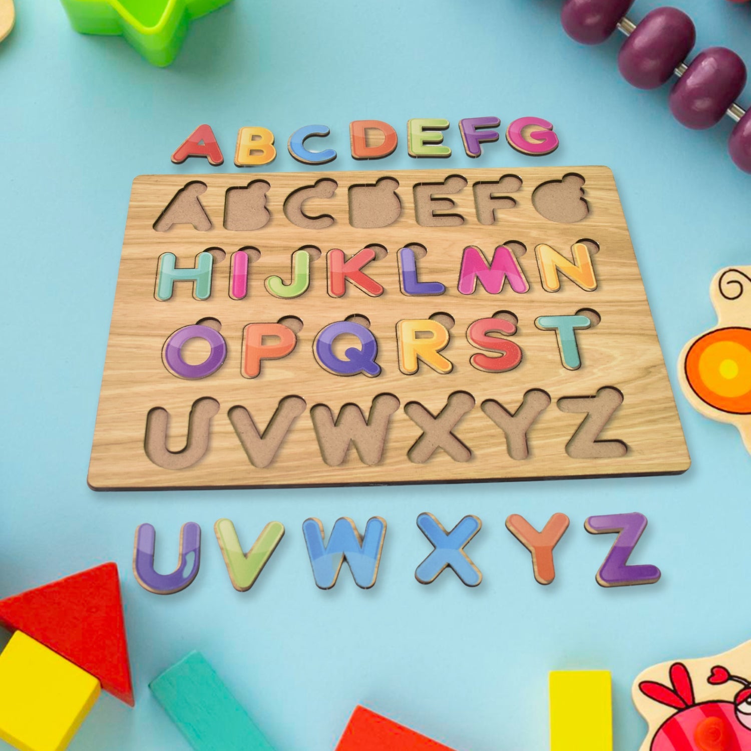 Educational wooden puzzle with individual alphabet letters and geometric shapes.