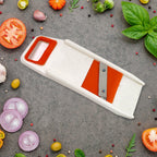 The Quickslice fruit dicer and vegetable grater with its various components displayed.