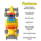 Front view of the plastic musical car toy, featuring blue and yellow piano-style keys for melodic play.