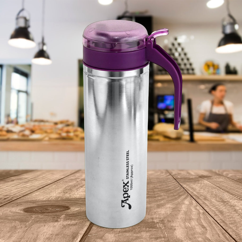 Side view of stainless steel oil pourer with flip lid