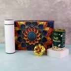Elegant gift hamper featuring kulfi almonds chocolate with golden decorative rose and metal bottle