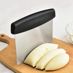 Using stainless steel dough scraper to cut and fold dough precisely