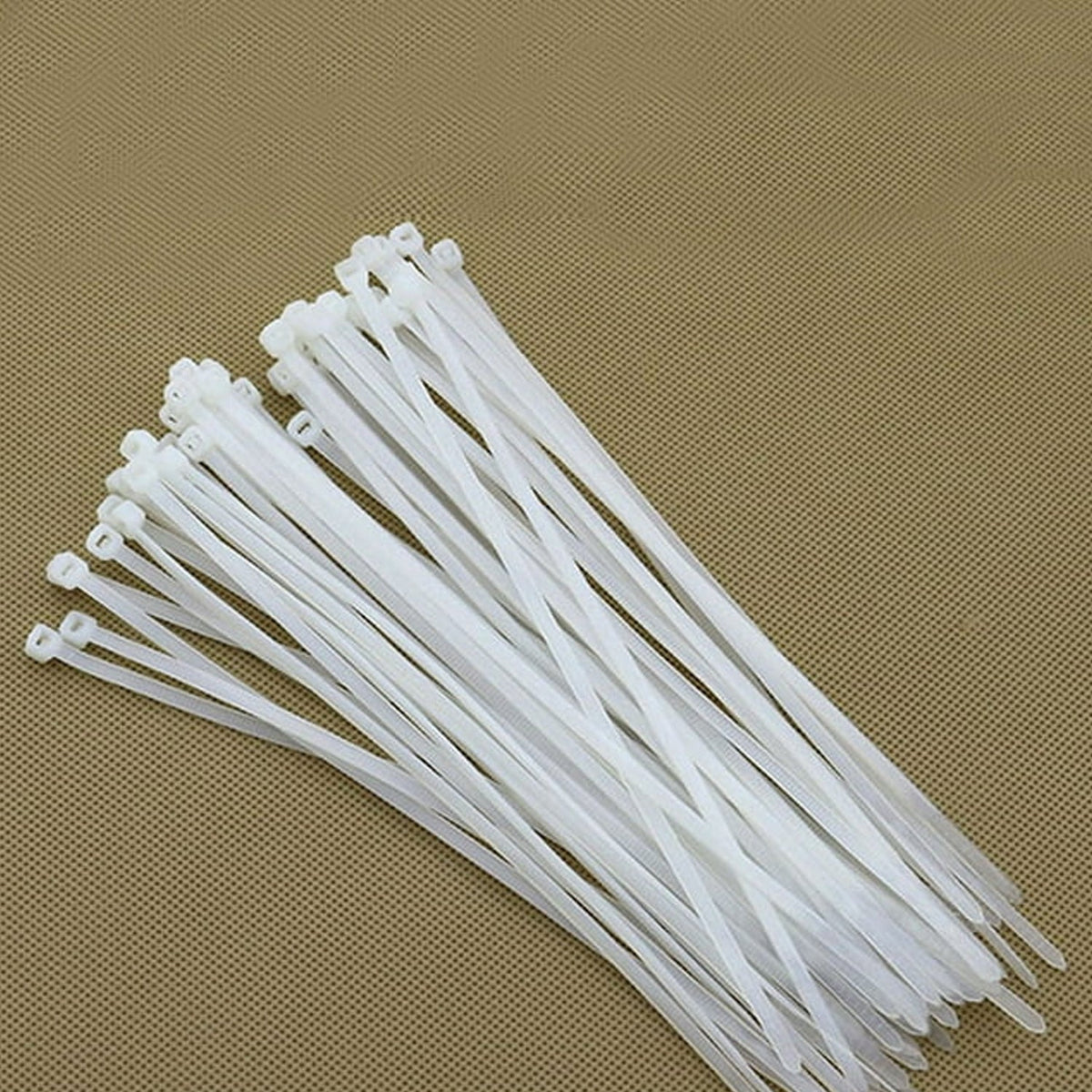 Close-up of 6-inch black nylon self-locking cable ties in a pack of 100.
