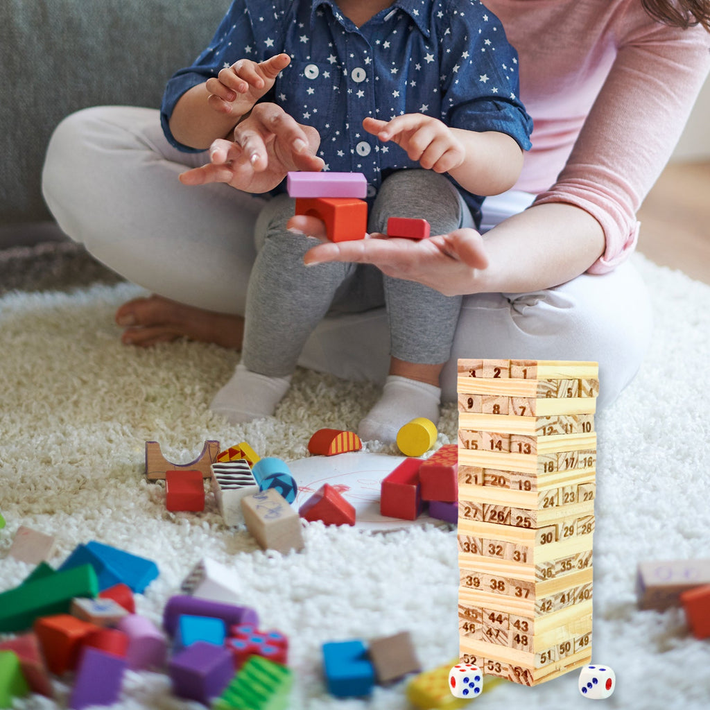 Box and contents of the Wooden Tumbling Tower Game Set including dice and blocks