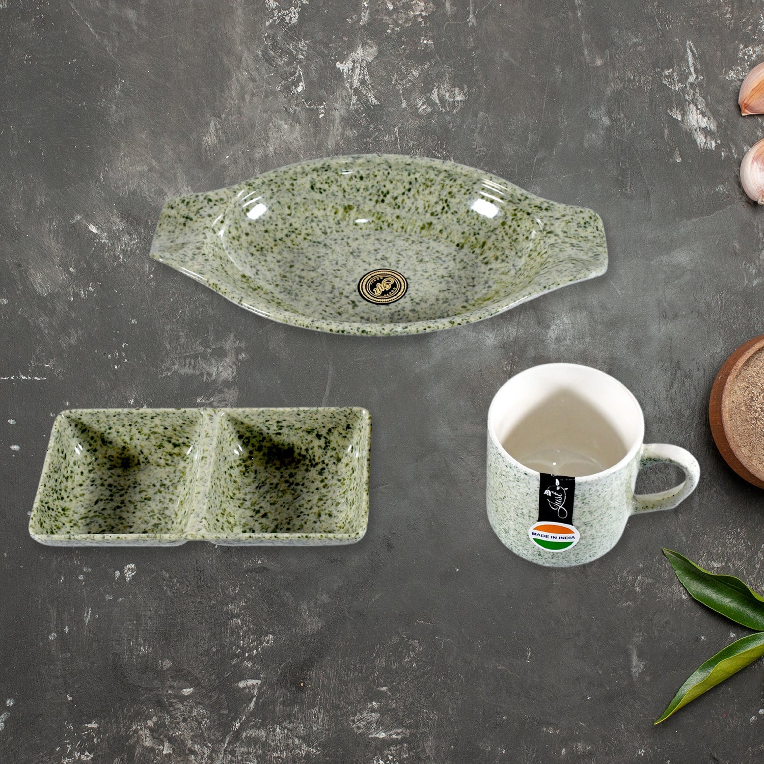 The versatile plastic snack platter and two-compartment chutney bowl from the Ceramic Snack & Tea Set, ready for serving.