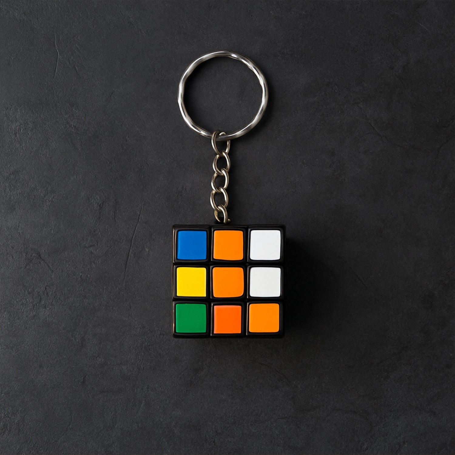 Detailed view of a Mini Magic Cube Puzzle keychain with bright, engaging colours.
