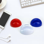 Top-down view showing the coin slot and phone resting on the owl Phone Holder with Coin Bank.